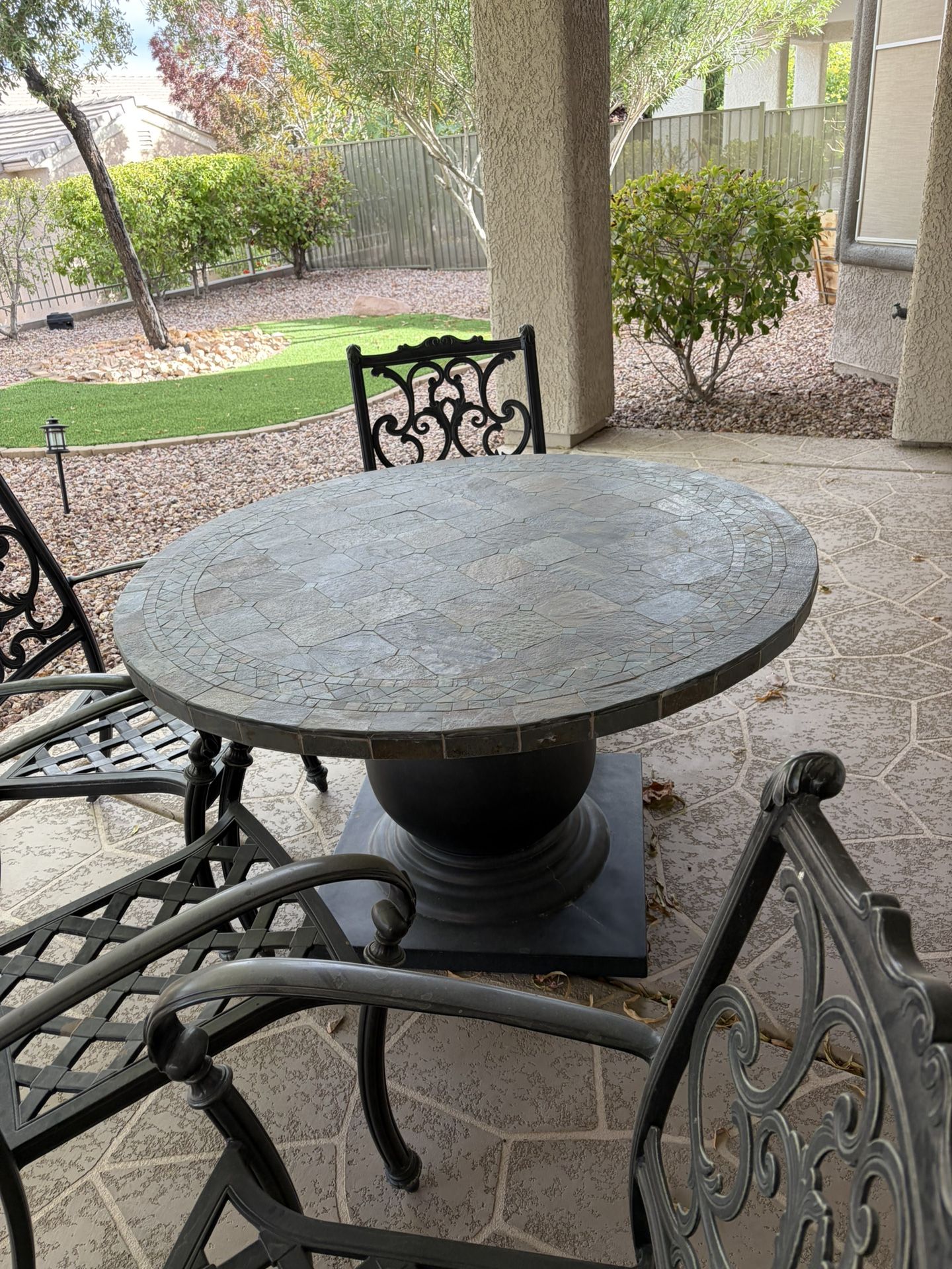 patio table about 4 foot round with four chairs and cushions extremely heavy must pick up $500