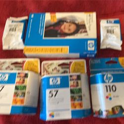 Assorted printer ink and photo paper. 