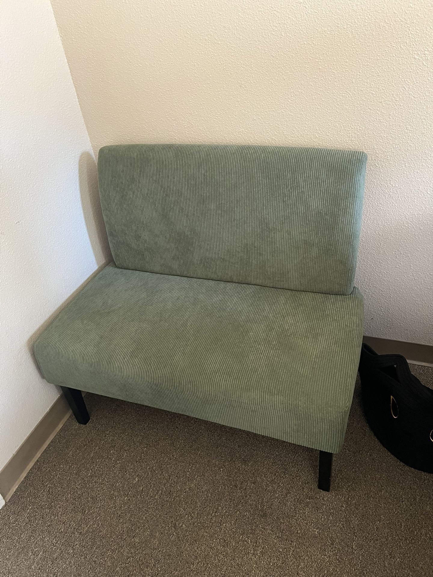 Small green couch corduroy