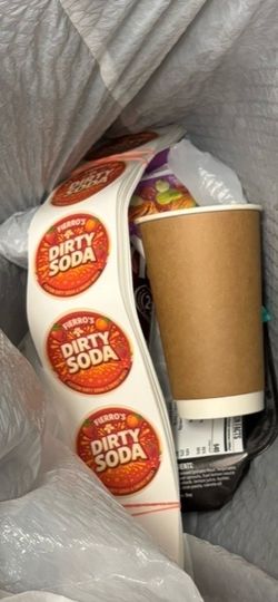 Custom stickers printed and thrown in the trash when not paid for