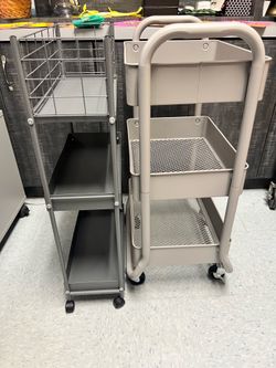 2 metal utility carts on wheels
