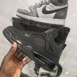 Black Cat Jordan 4s