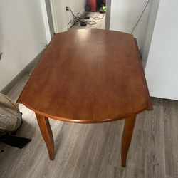 Wooden Table With Foldable Wings 