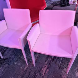 A Pair of White Leather Arm Chairs
