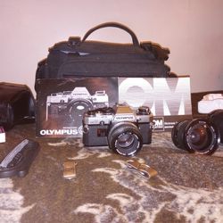Olympus Om10 55 Mm Lens With Other Lens And Items 