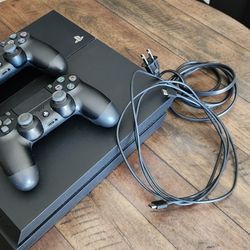PS4 w/ 2 Controllers And Games