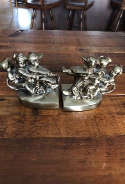 PM craftsman children playing tug of war vintage bookends.