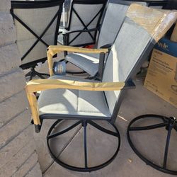 4 Brand New In Box Swivel Patio Chairs
