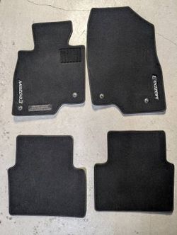 **FOR SALE**BRAND NEW MAZDA 3 OEM COMPLETE FACTORY FLOOR MAT SET