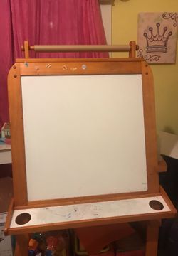 Double sided easel. Whiteboard/Chalkboard with storage bins on the bottom.