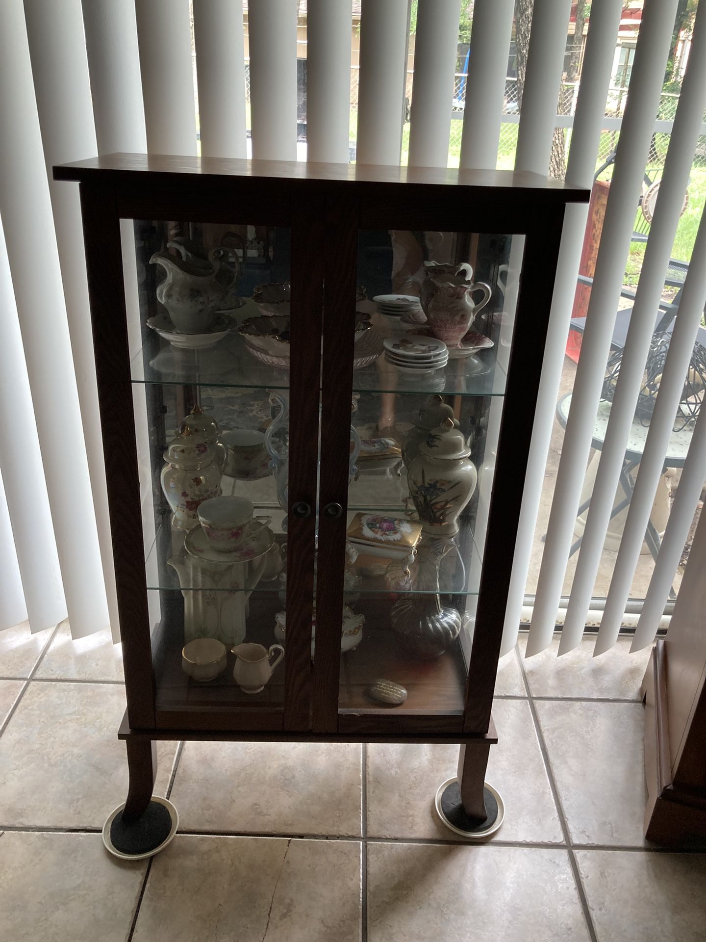 Glass cabinet with wood surroundings