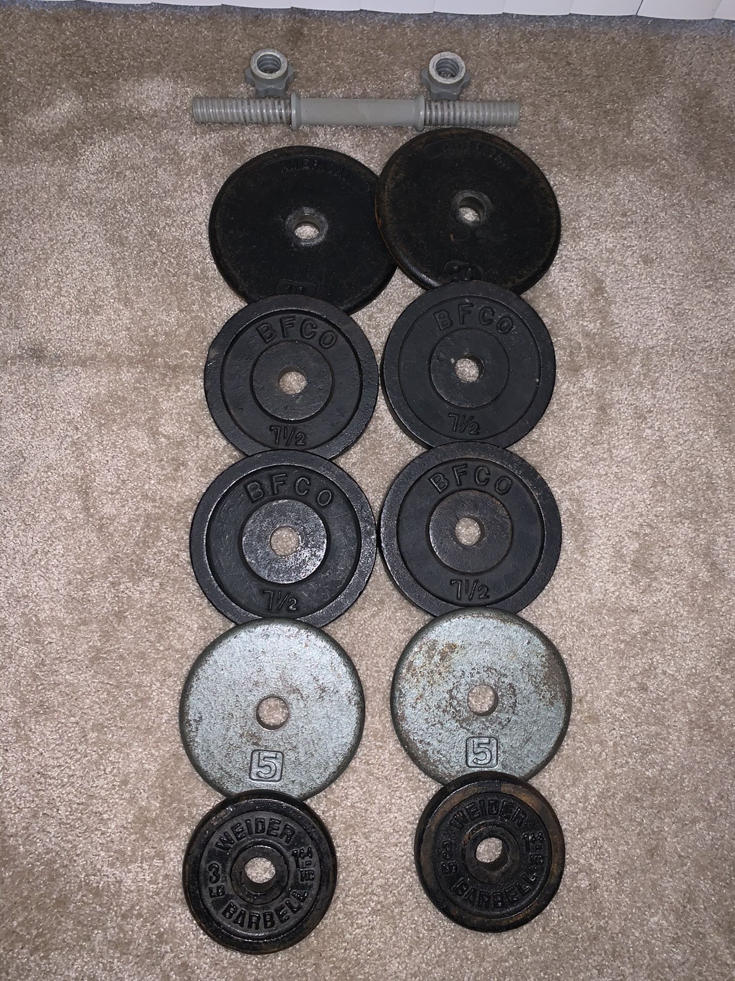Weight plates. 66lbs + 1 dumbbell handle
