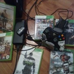 xbox 360 with 6 games 2 rechargable batterie pack n dock aswell as 2 controllers