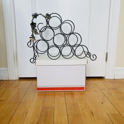 Antique Elegant Designer Wine Rack. Absolutely new. Never used. Nice decoration for your wine collection. Easily fits 9 bottles. High quality differen