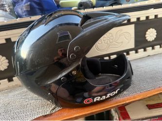 This glossy black Razor full face helmet is designed for multi-sport youth use,