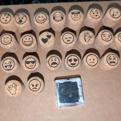 Set of 26 emoji Stamps with black ink pad 

All are in good stampable condition. 