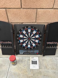 Fat Cat electronic dartboard in a full cabinet