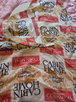 vintage-style apron made from fabric designed to resemble "Cabin Home" brand corn meal sacks.
