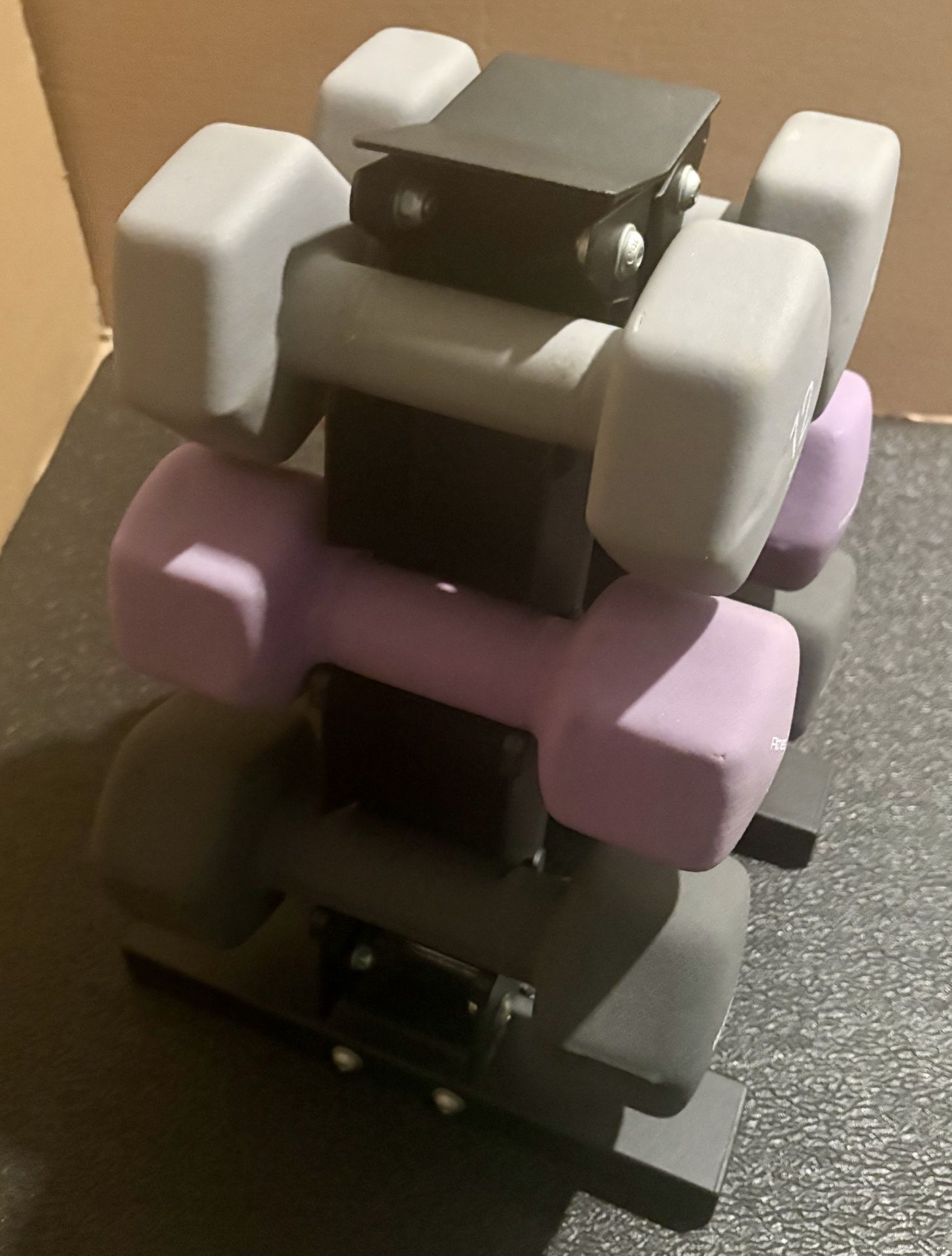 Cast Iron Neoprene Coat ...Set of Dumbbells with Rack; pairs of  12s, 15s and 17.5 lbs. 