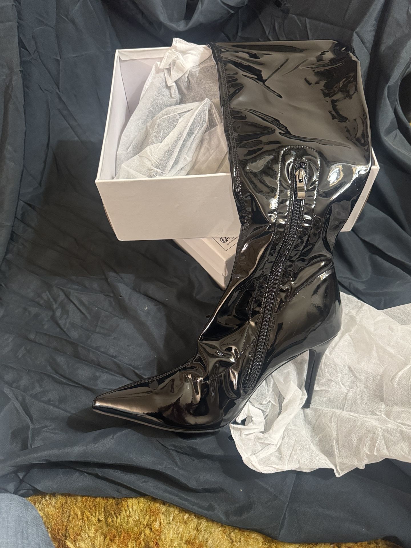 Woman’s thigh high boot