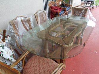 Glass dining room table with chairs