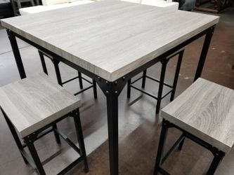 Grey counter height table with 4 stools