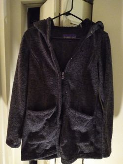 Madden Girl Sweater fleece outerwear jacket with full zip closure, and sherpa lined hood. Sherpa lined hood. Full zip