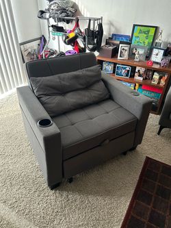 Gray armchair with pullout sleeper