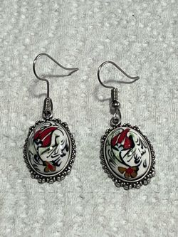 Custom-designed women's earrings with floral embroidery on porcelain.