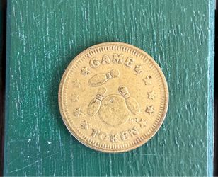 Vintage arcade game token with bowling ball & pins