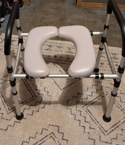 Raised toilet seat with handles