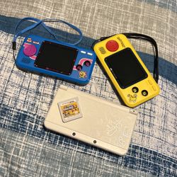 Nintendo 3DS and pac man hand held.