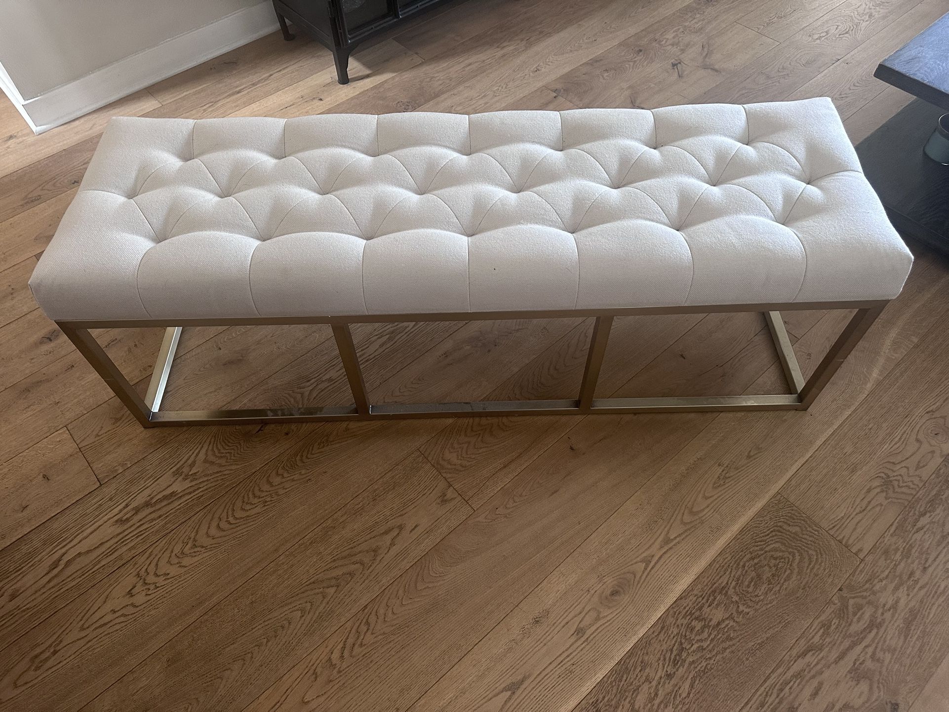 Tufted beige long bench with metal base
