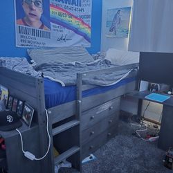 Loft bed with desk, dresser, shelf, and mattress included