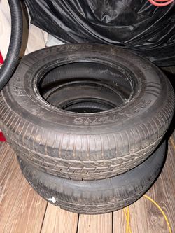 A pair of 245 70r16 tires