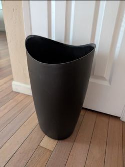large/oversized black trash garbage can wastebasket bin