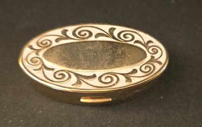 Vintage Max Factor gold-tone oval lipstick case