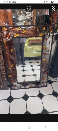 Used vintage steel wall mirror frame  with leafs