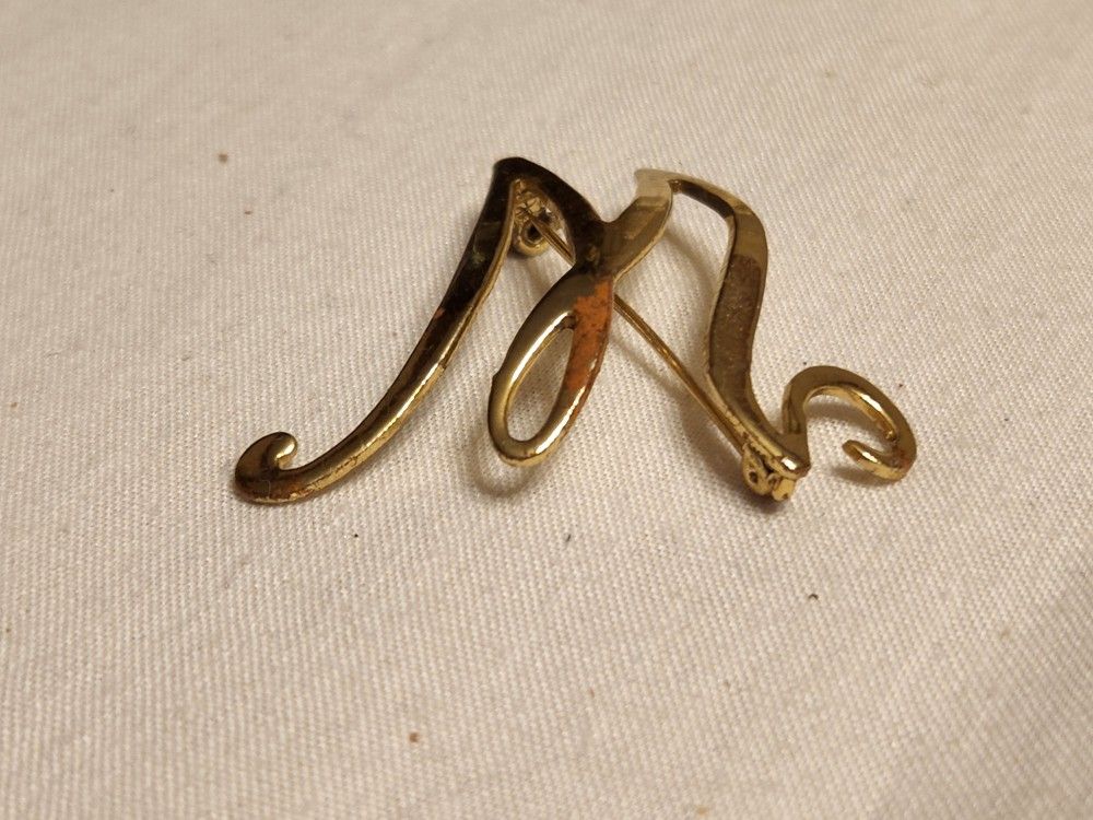 "M" Pin