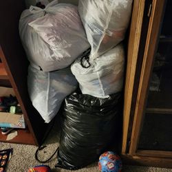 4 Bags Of Clothes And 1 Bag Of Toys 