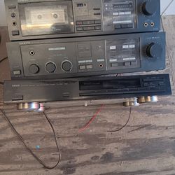 Onkyo amp. Tape Deck. Yamahs Tuner. and RCA 5 CD changer With Remote.