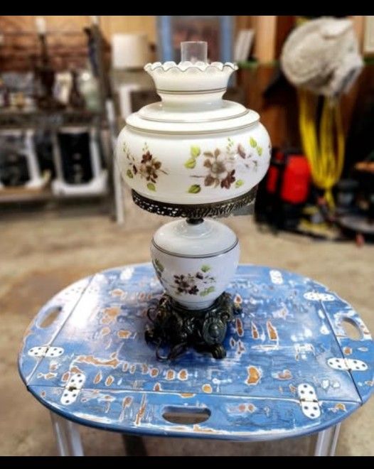 vintage milk glass hurricane lamp with hand-painted flowers and a brass base
