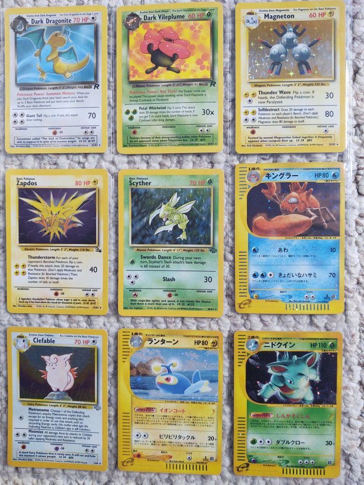 Pokemon cards Scyther and dark Vileplume left