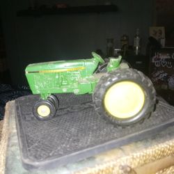 Older John Deere Medal Tractor.