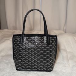Small tote bag, black/grey. Clean and well kept. Photos show the actual item. Please ask questions before purchasing.