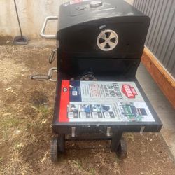 24 inch heavy duty charcoal grill with wheels only one time used (Pick Up And Cash Only )