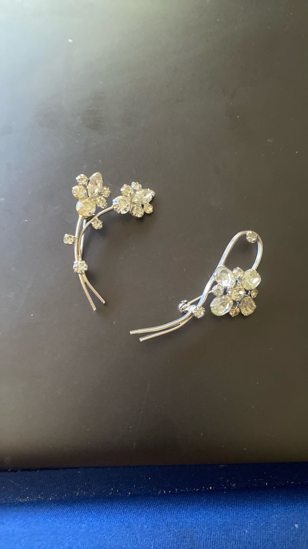A Couple Of Silver Diamond Broaches