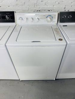 KitchenAid white washing machine, includes a receipt with a 60-day warranty.