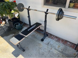 Bench with Olympic bar and weights