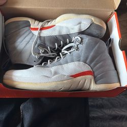 Nike Air Jordan 12 Retro Cool Grey Orange sneaker.